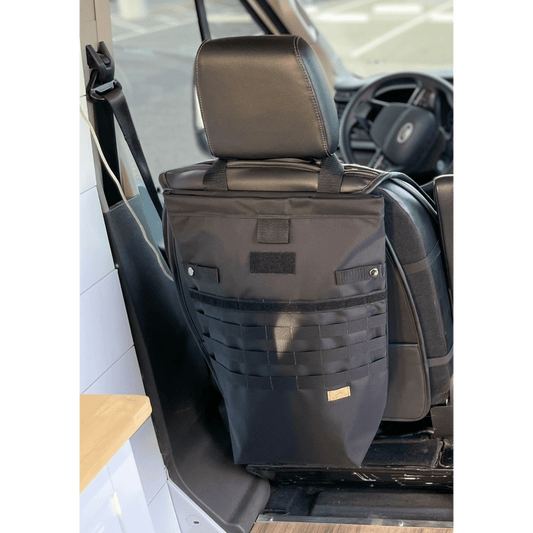 Tactical seat back organizer with MOLLE straps installed in a camper van