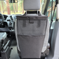A black seatback mesh laundry bag